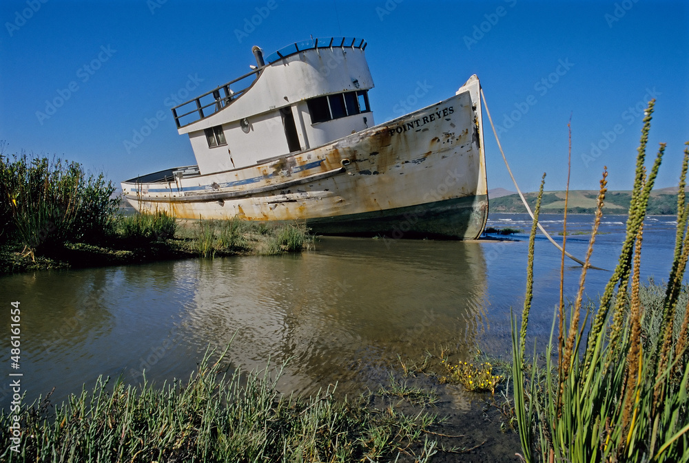 Old wrecked boat on tidal flats.