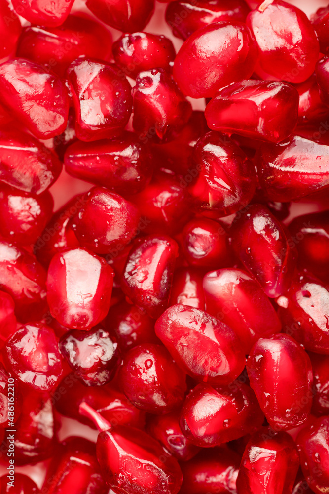 Beautiful background of red pomegranate seeds, pomegranate red close