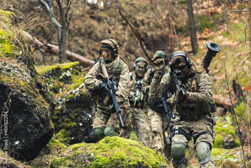 Mixed gender infantry marine squad on a infiltration mission photo