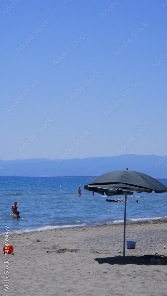 Wicker umbrellas on the beach 