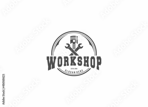 logo for motorized vehicle repair shop with repair tools and pistons