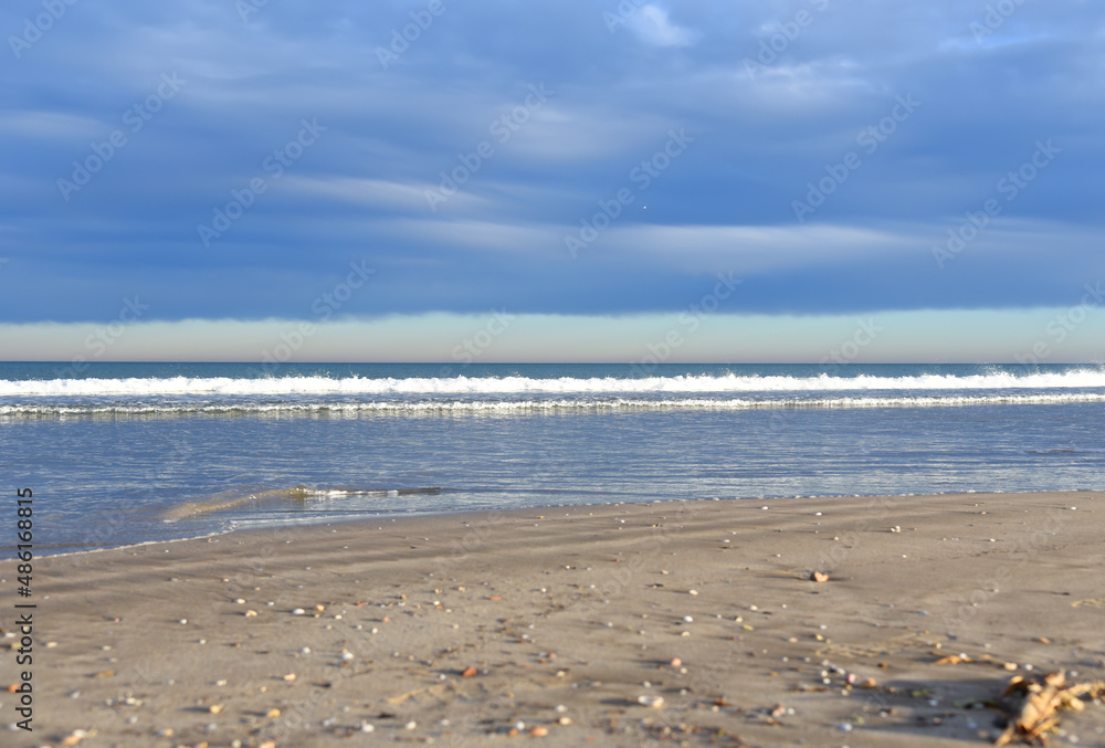 Waves at sea. Waves at sea during storm and wind. Wave from the sea goes on land to the beach. Splashing Waves in ocean, background, texture. Wave at Rising Storm. Waves at sea. Waves at sea during storm and wind. Wave from the sea goes on land to the beach. Splashing Waves in ocean, background, texture. Wave at Rising Storm.