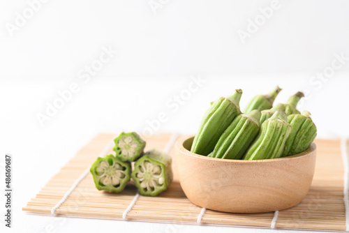 Green okra or ladies' fingers (Edible green seed pods), Organic vegetables from local farmer market photo