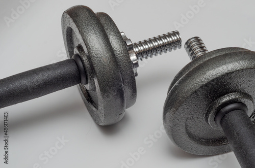 metal dumbbells on a white background. Motivation for sports.