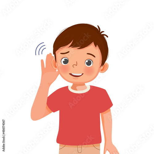 Little boy with hearing problem try listening carefully by putting his hand to ear 