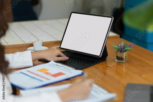 Cropped image, Businesswoman working with financial project on tablet.