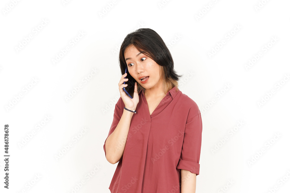 Make a Phone Call Using smartphone with angry face Of Beautiful Asian Woman Isolated On White Background Make a Phone Call Using smartphone with angry face Of Beautiful Asian Woman Isolated On White Background