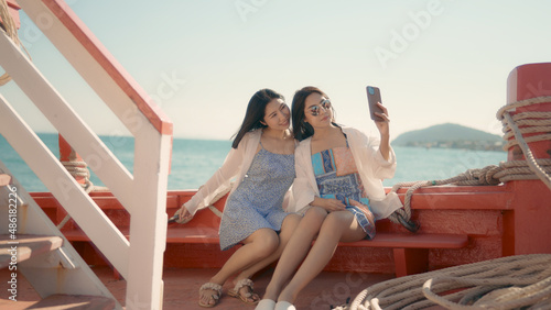 Two women travel by sea in the summer. © pigprox