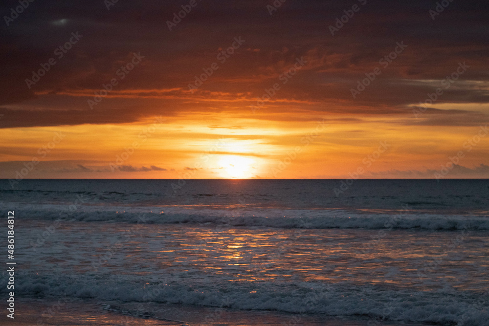 Sunset on ecuadorian beach at golden hour