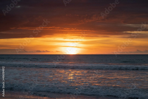 Fototapeta Naklejka Na Ścianę i Meble -  Sunset on ecuadorian beach at golden hour