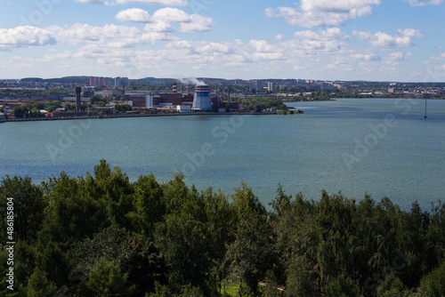 view from a height of a city pond, a green city, a beautiful summer landscape of a pond in a small town