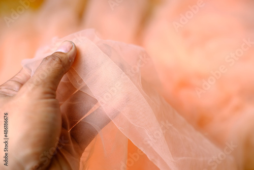 Close-up Hand holding fragment of ballet tutus