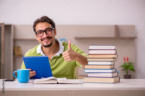 Young male student studying at home