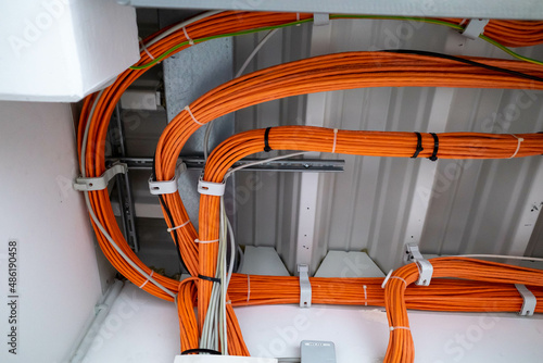 Obraz na płótnie orange network cables run bundled under the ceiling w salonie