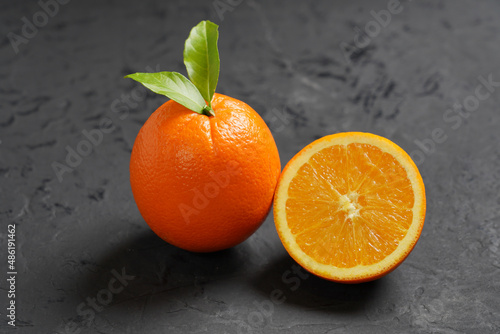 Fresh Orange fruit on black stone table background.Orange Fruit