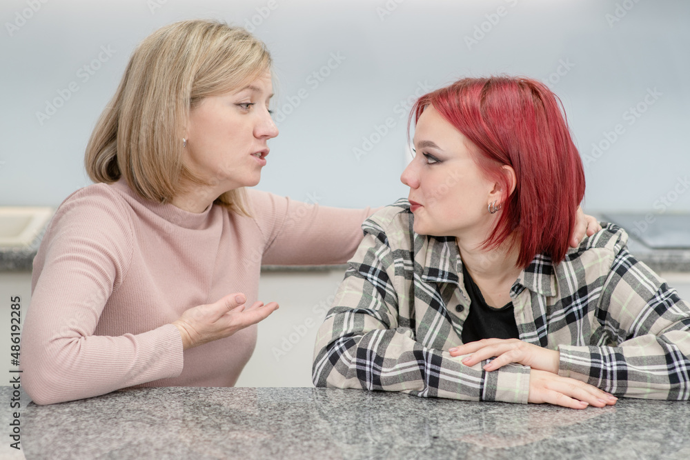 Careful mother talks with her teen daughter about her problems. Teenagers problem concept Careful mother talks with her teen daughter about her problems. Teenagers problem concept