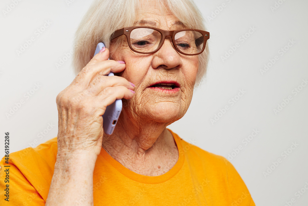 elderly woman happy lifestyle in yellow t-shirts close-up emotions elderly woman happy lifestyle in yellow t-shirts close-up emotions