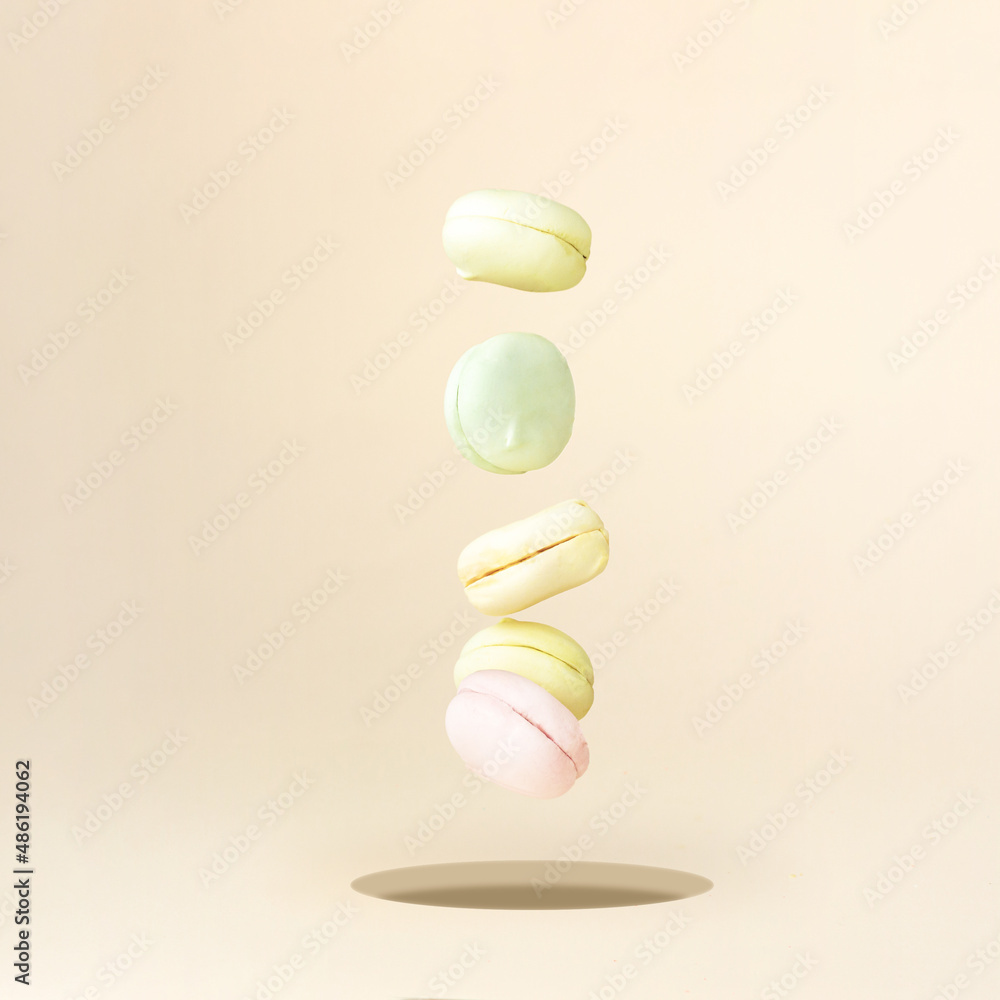 Macaron marshmallow Dessert falling down. Colorful Macaroons Flying. Gourmet Colored Macaroon Cookies Macaron marshmallow Dessert falling down. Colorful Macaroons Flying. Gourmet Colored Macaroon Cookies
