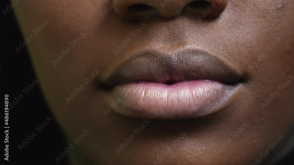 A black girl close-up mouth an african woman face macro A black girl close-up mouth an african woman face macro