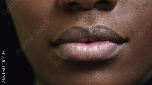 A black girl close-up mouth an african woman face macro photo