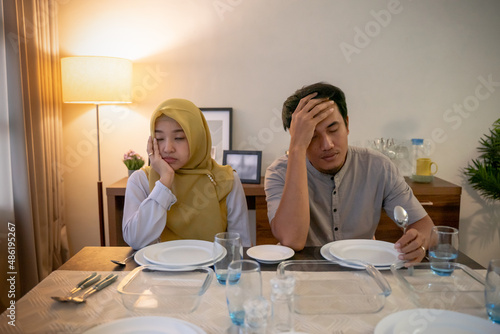 muslim couple having break fast or sahur in the morning photo
