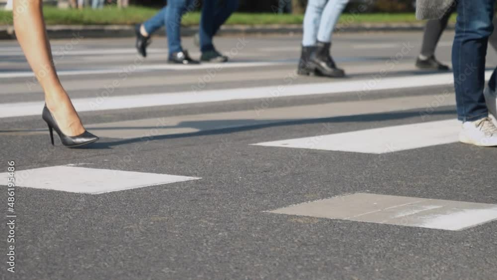 Gen Z corporate choice of footwear passing zebra crossing Gen Z corporate choice of footwear passing zebra crossing