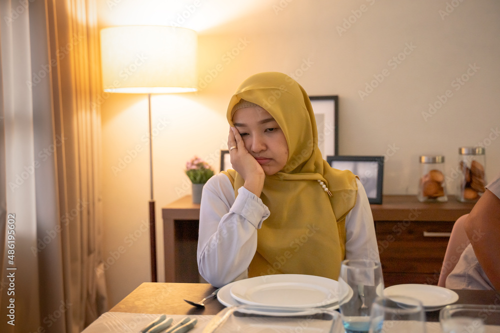 tired woman having break fast or sahur in the morning tired woman having break fast or sahur in the morning