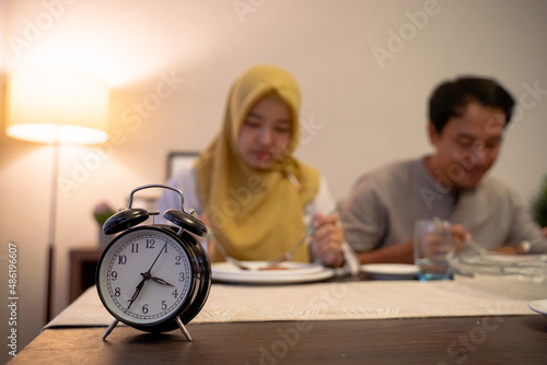 muslim couple having breakfast or sahur photo