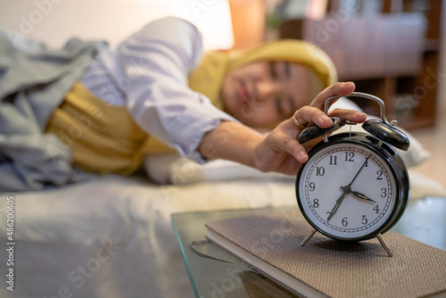 beautiful sleeping muslim woman in the bed photo