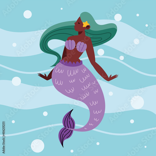 mermaid swimming in sea