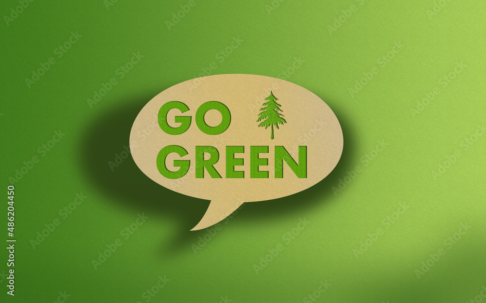 Go Green Text on Recycled Craft Paper Againt Green Grass Background Go Green Text on Recycled Craft Paper Againt Green Grass Background