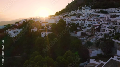 Drone shot of a hillside apartment resort in Mijas,Spain, at sunset.