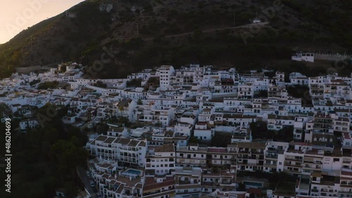 Scenic drone shot of hillside Mijas town in Andalusia,Spain, at sunset.