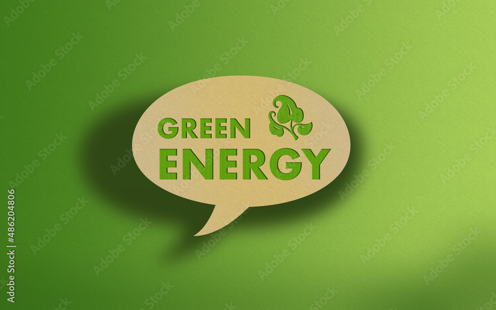 Green Energy Text on Recycled Craft Paper Againt Green Grass Background Green Energy Text on Recycled Craft Paper Againt Green Grass Background