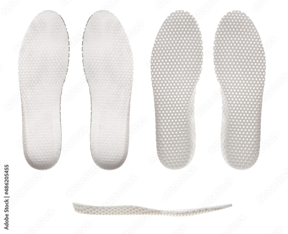 White, anatomical, ventilated insoles, isolated on a white background, a set of three types White, anatomical, ventilated insoles, isolated on a white background, a set of three types