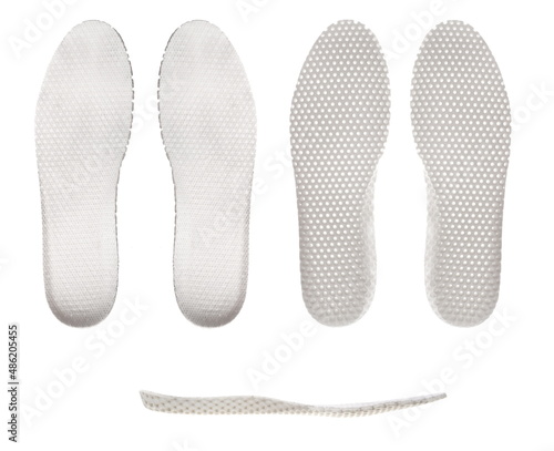 White, anatomical, ventilated insoles, isolated on a white background, a set of three types