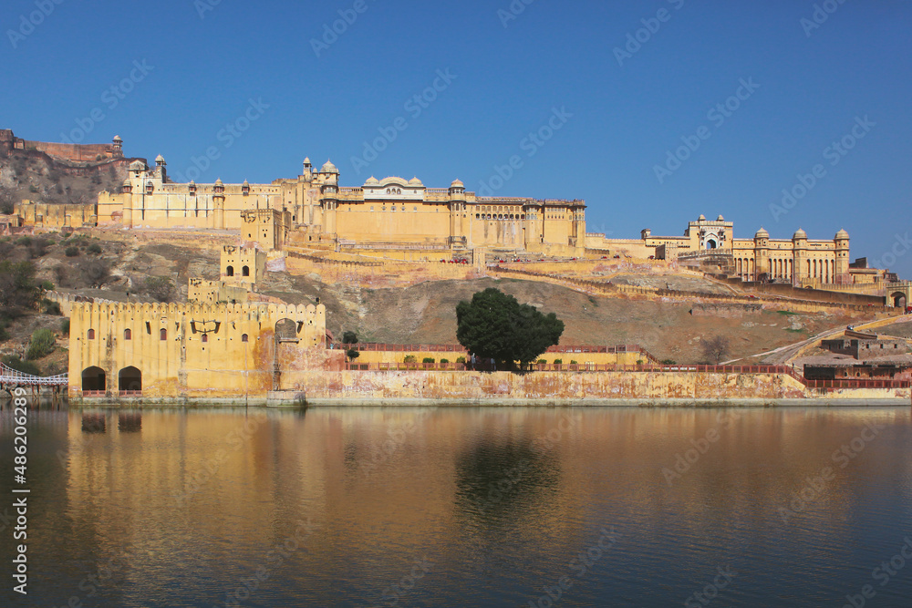 view from the lake of the Indian architectural monument Amber Fort in Jaipur, Rajasthan