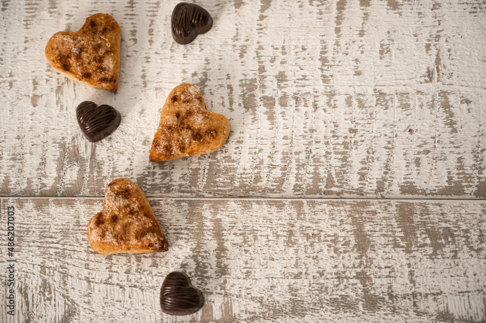 Flatlay of cookies and heart shaped chocolate Flatlay of cookies and heart shaped chocolate