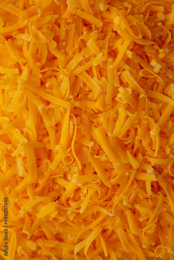 Shredded Sharp Cheddar Cheese background Shredded Sharp Cheddar Cheese background