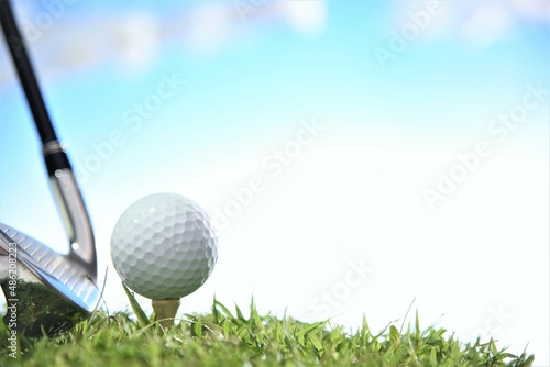 golf ball and tee with club