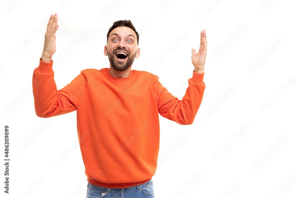joyful happy man emotionally waving his hands gesturing with open mouth and smile joyful happy man emotionally waving his hands gesturing with open mouth and smile
