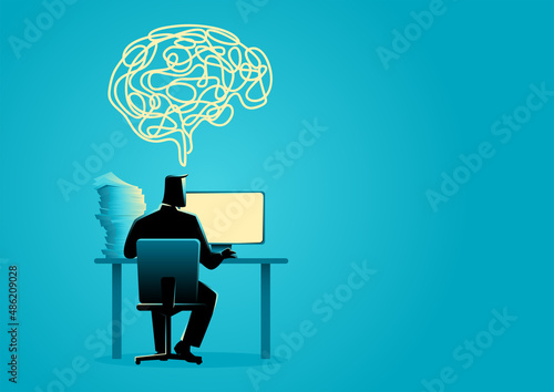 Man working behind desktop computer from back view