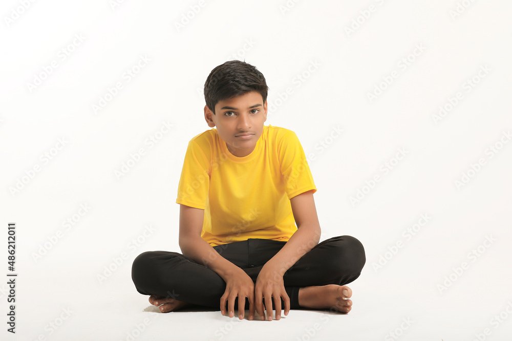 Indian child giving expression on white background.