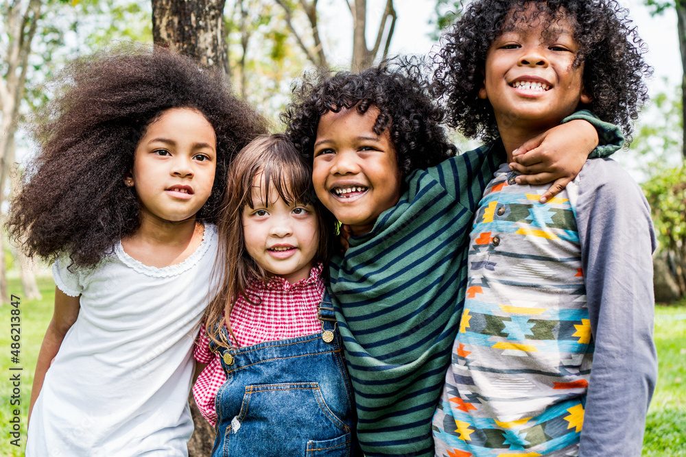 happiness children smile have fun and hug each other relax in weekend holiday lifestyle park outdoor nature background. happiness children smile have fun and hug each other relax in weekend holiday lifestyle park outdoor nature background.