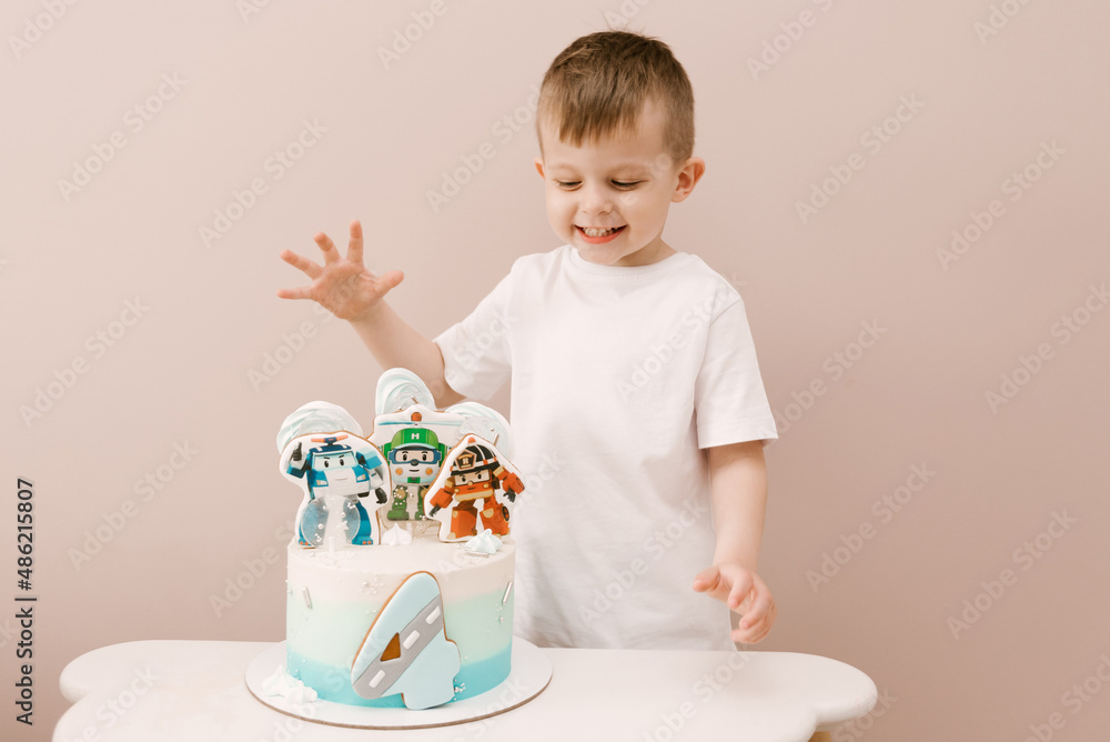 A beautiful boy and a children's cake for the 4th birthday A beautiful boy and a children's cake for the 4th birthday
