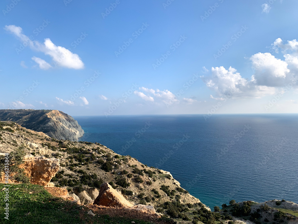 Rocky coastline, vivid sea and beautiful bright sky Rocky coastline, vivid sea and beautiful bright sky