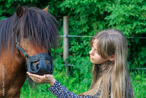 teenage caucasian white girl with her pony horse © Michael Niessen