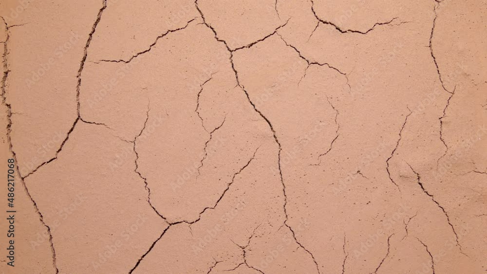 Cracked soil. Global climate change and ecology. Drying out of the desert. Evaporation of water from the soil. Global warming and temperature increase on the Earth. Cracks on the surface. Cracked soil. Global climate change and ecology. Drying out of the desert. Evaporation of water from the soil. Global warming and temperature increase on the Earth. Cracks on the surface.