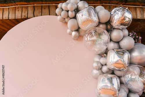 Obraz na płótnie Round pink photo zone made of silver balloons with space to copy your text. Party decorated with balloons w salonie