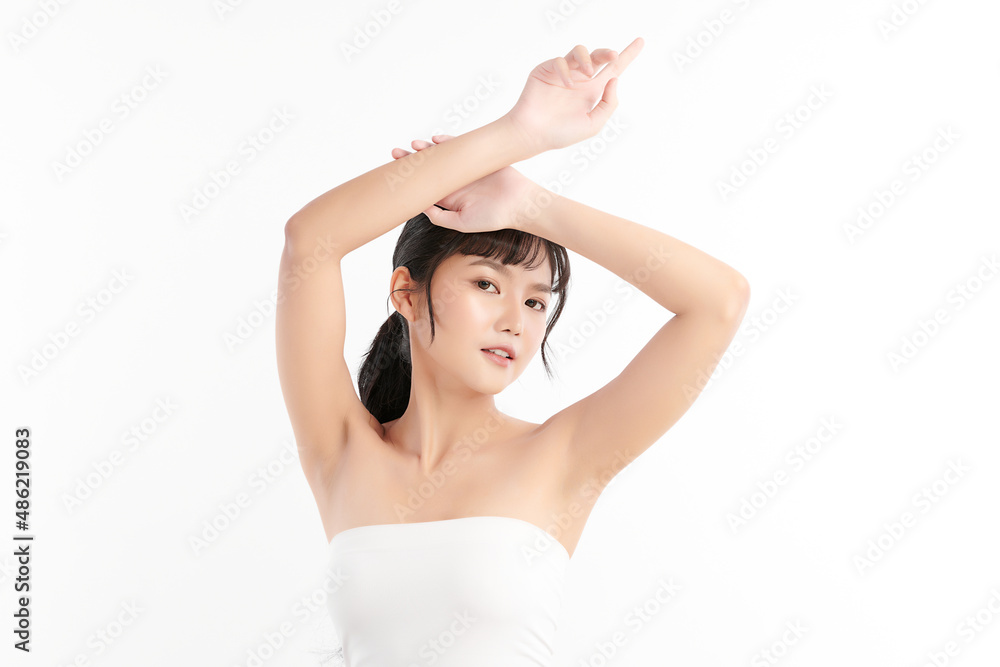 Beautiful Young Asian woman lifting hands up to show off clean and hygienic armpits or underarms on white background, Smooth armpit cleanliness and protection concept Beautiful Young Asian woman lifting hands up to show off clean and hygienic armpits or underarms on white background, Smooth armpit cleanliness and protection concept